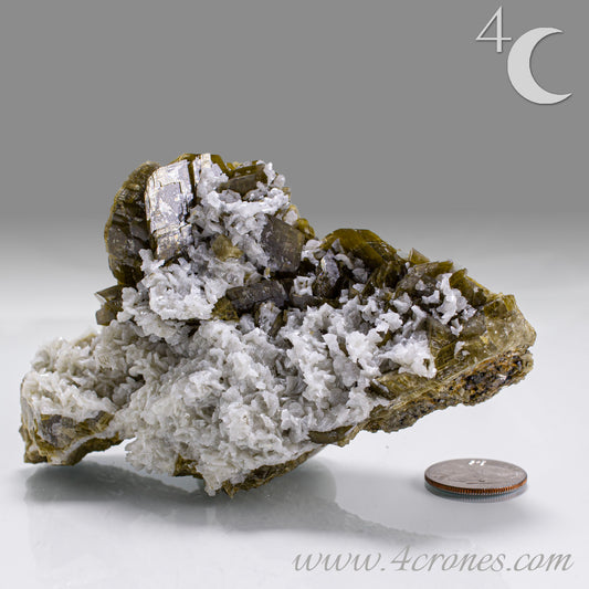 This unique pairing of Siderite, an iron carbonate mineral, and Dolomite, a calcium magnesium carbonate, forms in earthy clusters and blocky crystals that range from honeyed brown to soft cream.