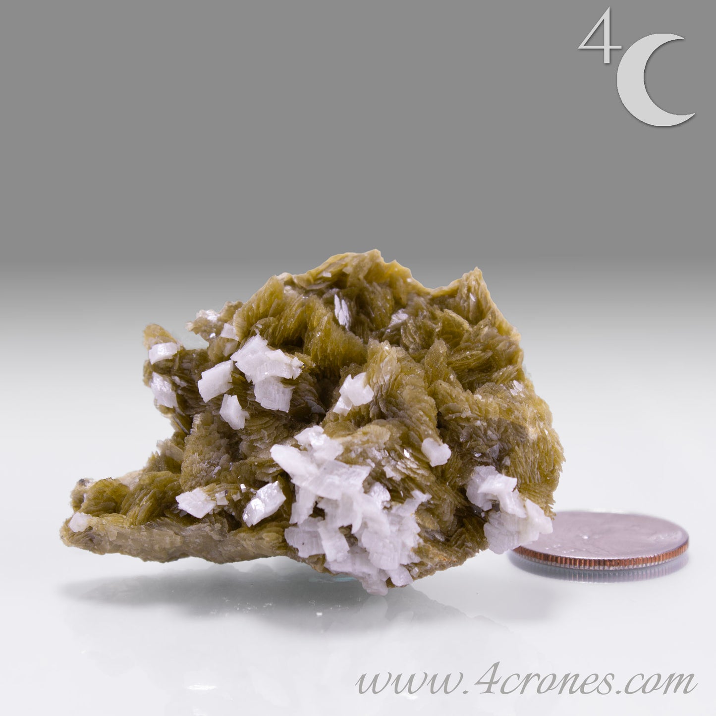 This unique pairing of Siderite, an iron carbonate mineral, and Dolomite, a calcium magnesium carbonate, forms in earthy clusters and blocky crystals that range from honeyed brown to soft cream.