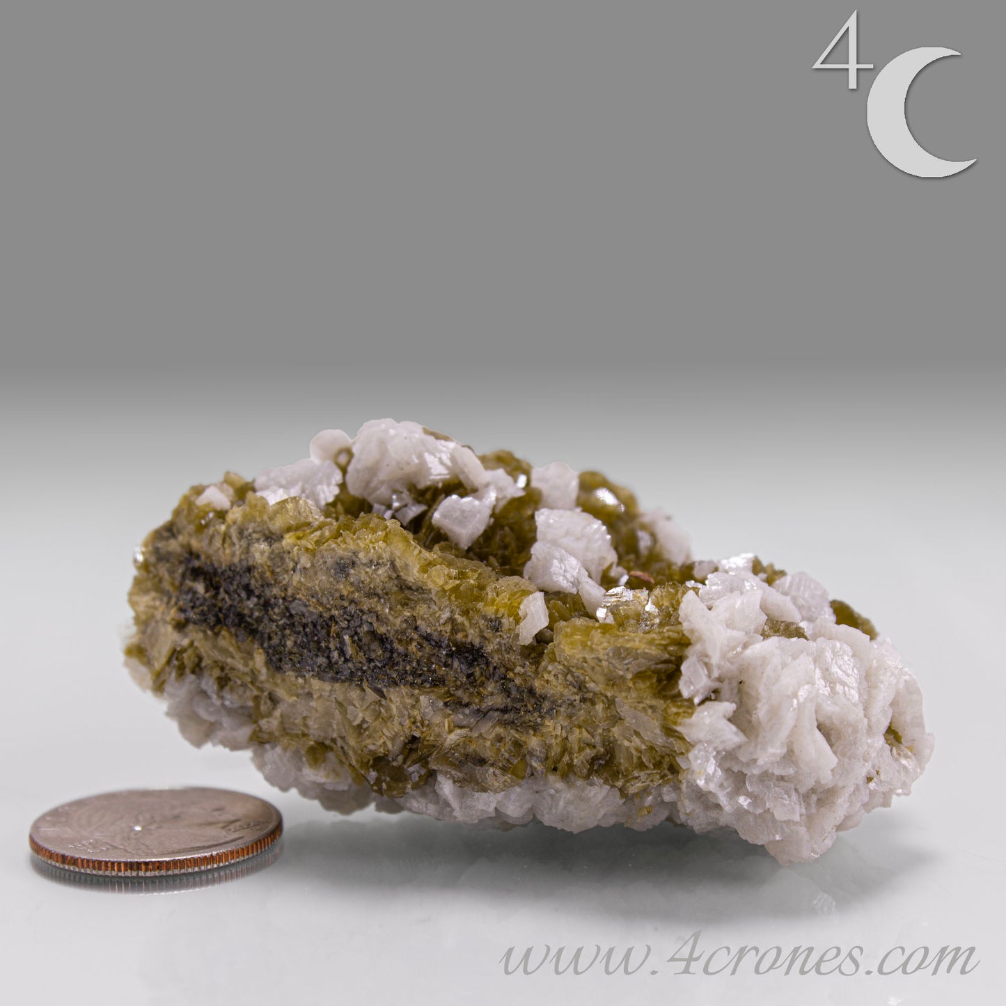 This unique pairing of Siderite, an iron carbonate mineral, and Dolomite, a calcium magnesium carbonate, forms in earthy clusters and blocky crystals that range from honeyed brown to soft cream.
