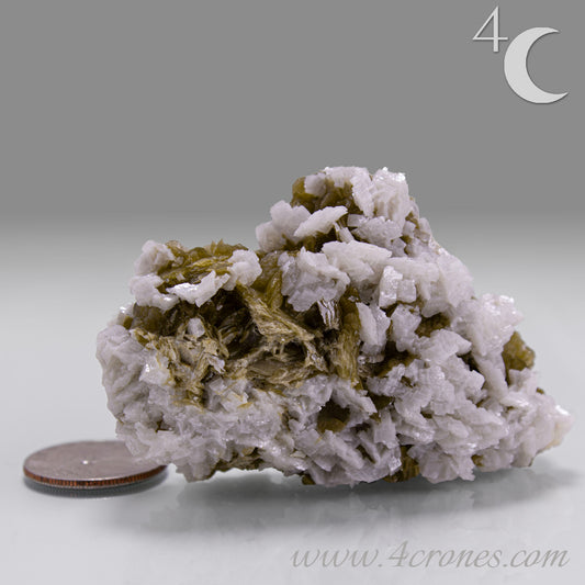 This unique pairing of Siderite, an iron carbonate mineral, and Dolomite, a calcium magnesium carbonate, forms in earthy clusters and blocky crystals that range from honeyed brown to soft cream.
