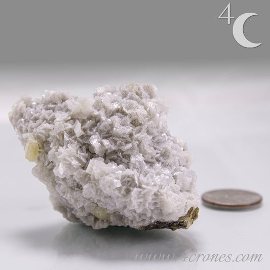 This unique pairing of Siderite, an iron carbonate mineral, and Dolomite, a calcium magnesium carbonate, forms in earthy clusters and blocky crystals that range from honeyed brown to soft cream.