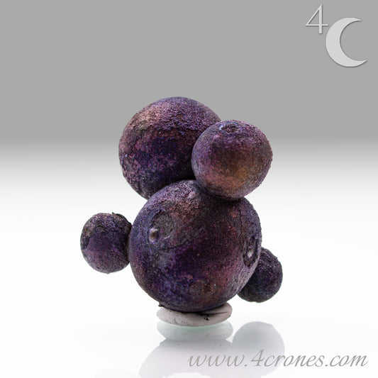 These stunning Chalcopyrite copper iron sulfide spheres (CuFeS₂) showcase a metallic golden luster with vibrant iridescent hues of purple, blue, and green. Formed through hydrothermal processes in Daye, Hubei Province, they crystallize in the tetragonal system and are valued for their aesthetic and energetic properties.