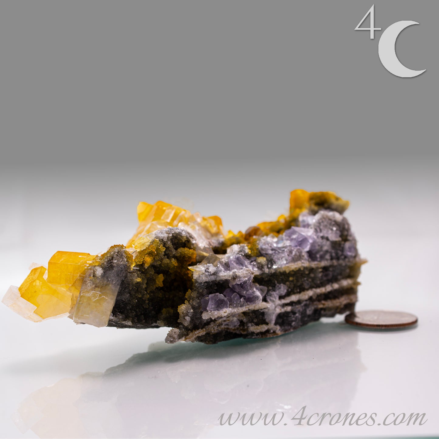 Iridescent Columnar Calcite is a striking variety of calcite distinguished by its naturally occurring columnar structure and shimmering, pearlescent sheen. This calcium carbonate mineral forms in elongated, parallel crystal columns, often displaying a soft, ethereal glow due to light interference within its layers. Its iridescence results from microscopic structural variations that reflect and refract light, producing subtle flashes of color that shift with movement. 