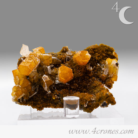 Iridescent Columnar Calcite is a striking variety of calcite distinguished by its naturally occurring columnar structure and shimmering, pearlescent sheen. This calcium carbonate mineral forms in elongated, parallel crystal columns, often displaying a soft, ethereal glow due to light interference within its layers. Its iridescence results from microscopic structural variations that reflect and refract light, producing subtle flashes of color that shift with movement. 