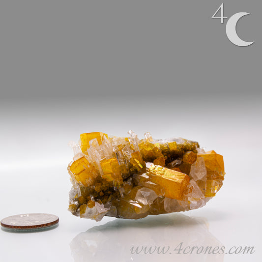 Iridescent Columnar Calcite is a striking variety of calcite distinguished by its naturally occurring columnar structure and shimmering, pearlescent sheen. This calcium carbonate mineral forms in elongated, parallel crystal columns, often displaying a soft, ethereal glow due to light interference within its layers. Its iridescence results from microscopic structural variations that reflect and refract light, producing subtle flashes of color that shift with movement. 