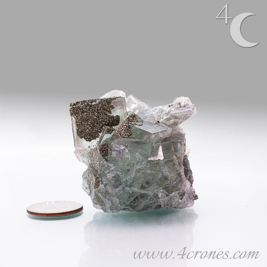 Fluorite & Pyrite beautiful lavender and soft green. This unique specimen of fluorite shimmers in soft bands of lavender and green, a natural harmony of color and energy. Composed of calcium fluoride, fluorite is valued for its cubic crystal formation and its ability to bring mental clarity and energetic alignment.