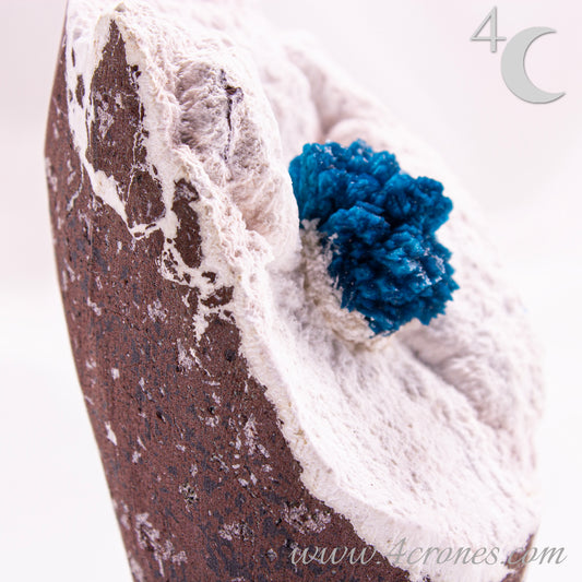Cavansite is a rare calcium vanadium silicate mineral prized for its vivid blue color and rosette-like crystal formations