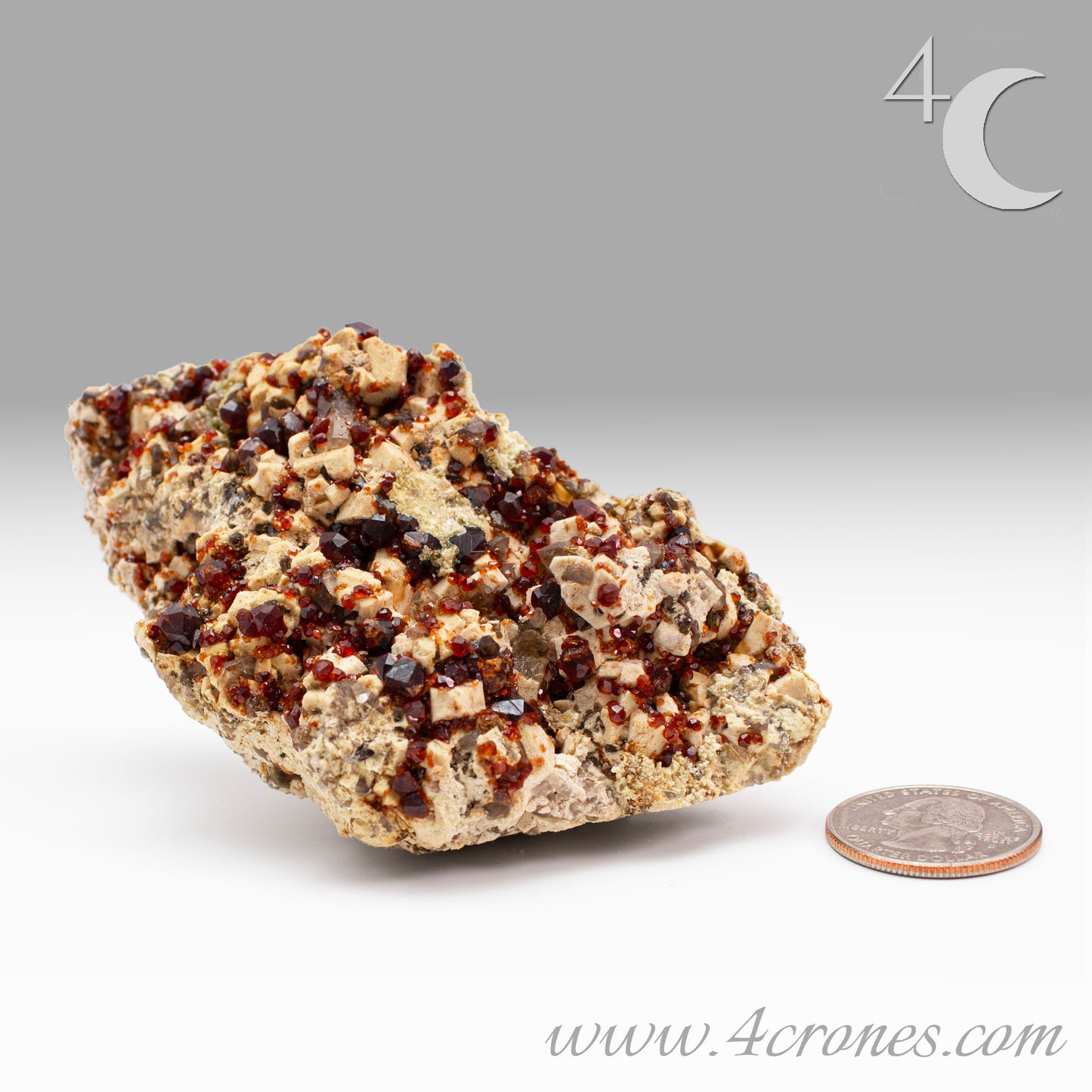 These gemmy Garnets are known as Spessartine Red Garnets, and they encrust and surround beautiful Smoky Quartz crystals on microcline feldspar matrices. The mine these specimens come from is known for the beautiful blingy red- and orange-colored garnets that they yield. www.4crones.com