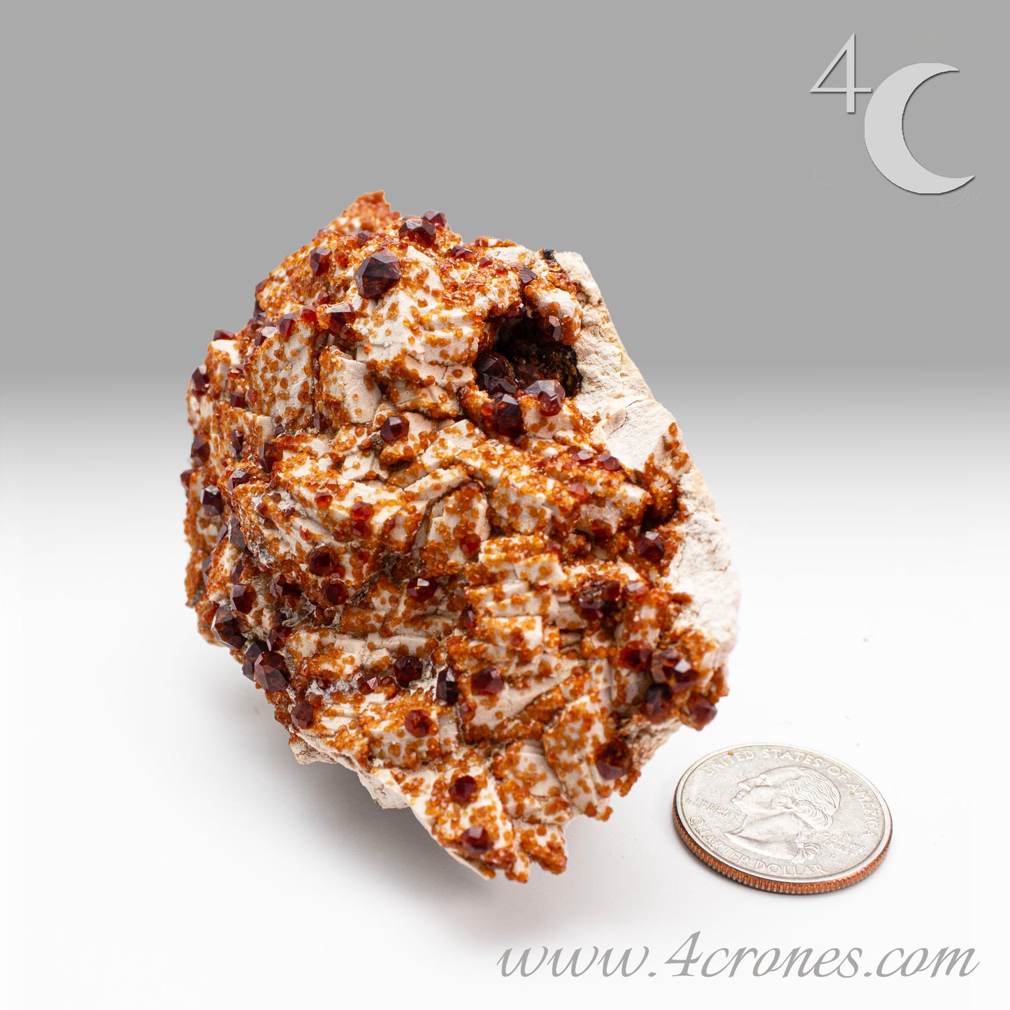 These gemmy Garnets are known as Spessartine Red Garnets, and they encrust and surround beautiful Smoky Quartz crystals on microcline feldspar matrices. The mine these specimens come from is known for the beautiful blingy red- and orange-colored garnets that they yield. www.4crones.com