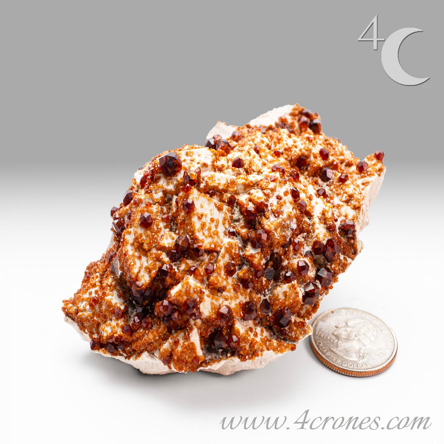 These gemmy Garnets are known as Spessartine Red Garnets, and they encrust and surround beautiful Smoky Quartz crystals on microcline feldspar matrices. The mine these specimens come from is known for the beautiful blingy red- and orange-colored garnets that they yield. www.4crones.com