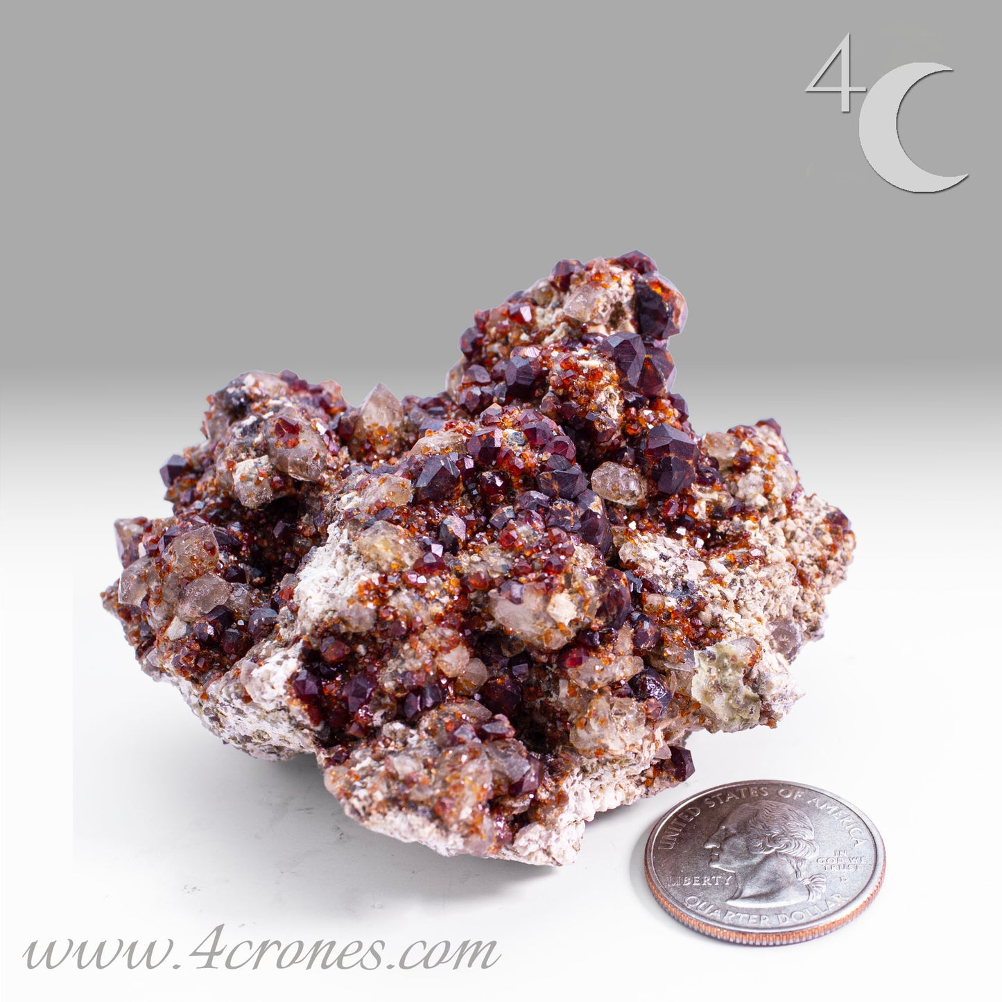 These gemmy Garnets are known as Spessartine Red Garnets, and they encrust and surround beautiful Smoky Quartz crystals on microcline feldspar matrices. The mine these specimens come from is known for the beautiful blingy red- and orange-colored garnets that they yield. www.4crones.com
