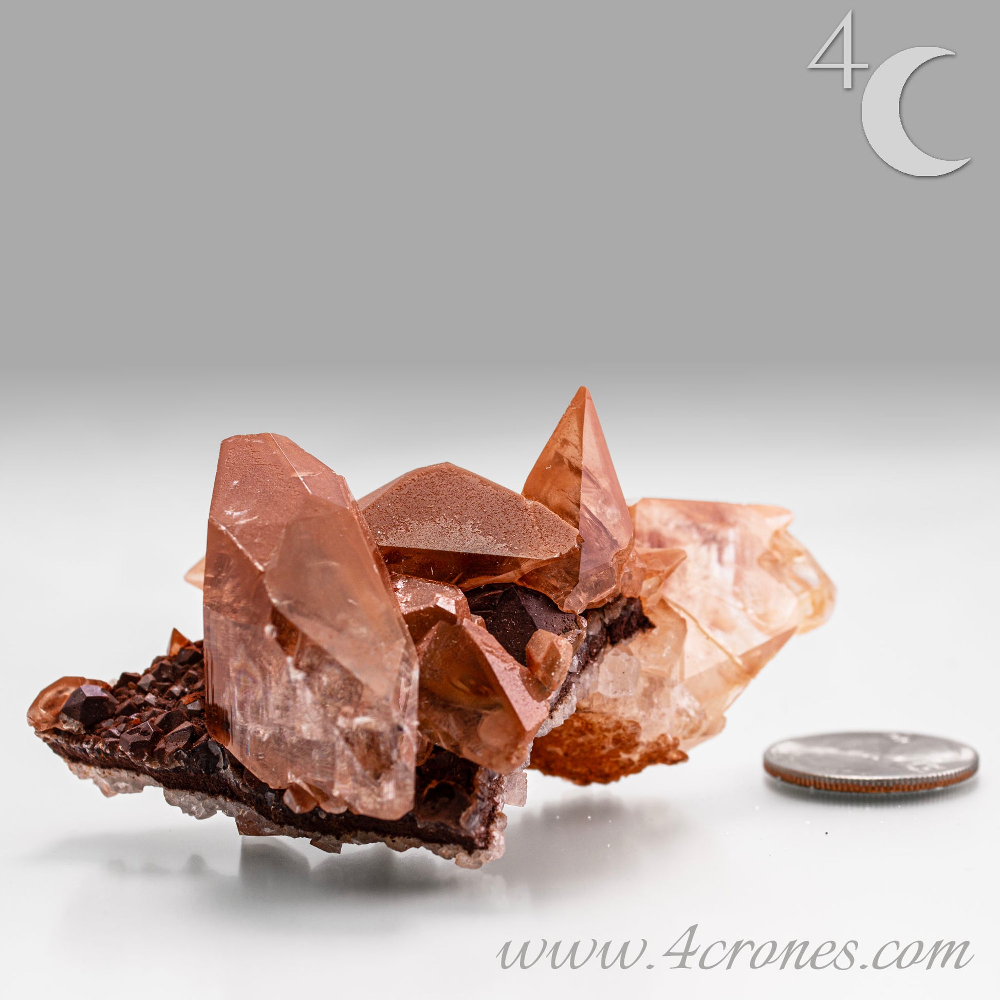 Red Diamond Calcite, glassy, gemmy diamond shaped geometries otherwise known as rhombohedrons and or scalenohedrons are combined with iron oxide hematoid inclusions. www.4crones.com