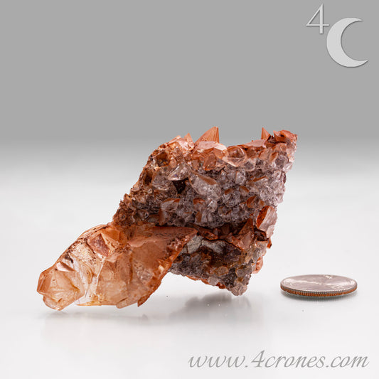 Red Diamond Calcite, glassy, gemmy diamond shaped geometries otherwise known as rhombohedrons and or scalenohedrons are combined with iron oxide hematoid inclusions. www.4crones.com