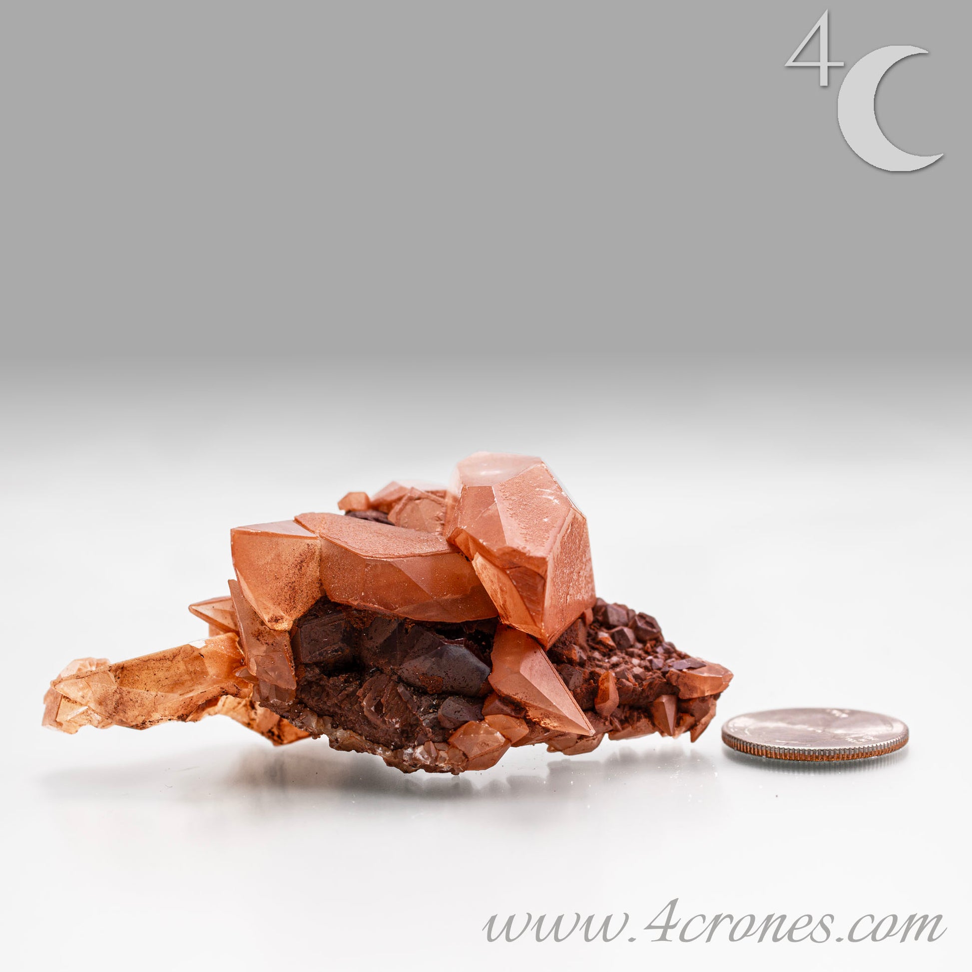 Red Diamond Calcite, glassy, gemmy diamond shaped geometries otherwise known as rhombohedrons and or scalenohedrons are combined with iron oxide hematoid inclusions. www.4crones.com
