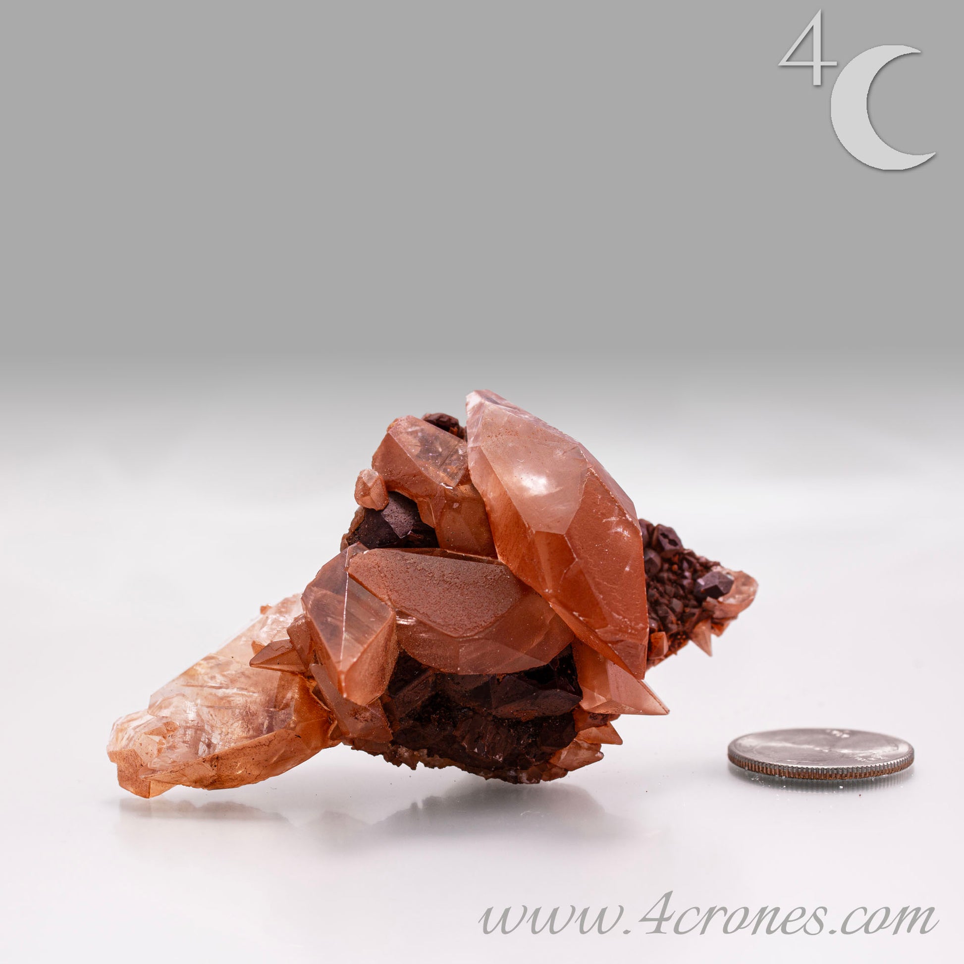 Red Diamond Calcite, glassy, gemmy diamond shaped geometries otherwise known as rhombohedrons and or scalenohedrons are combined with iron oxide hematoid inclusions. www.4crones.com