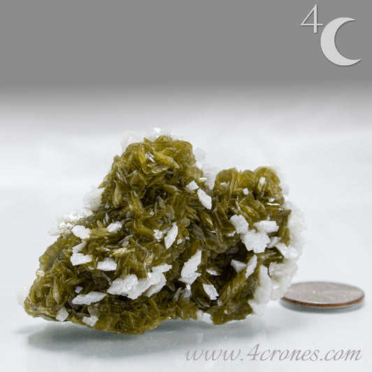 This unique pairing of Siderite, an iron carbonate mineral, and Dolomite, a calcium magnesium carbonate, forms in earthy clusters and blocky crystals that range from honeyed brown to soft cream.