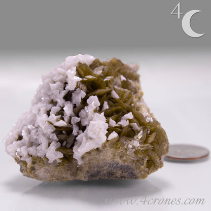 This unique pairing of Siderite, an iron carbonate mineral, and Dolomite, a calcium magnesium carbonate, forms in earthy clusters and blocky crystals that range from honeyed brown to soft cream.