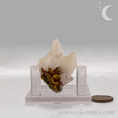 Orpiment mineral with layered golden formation on light matrix, side view