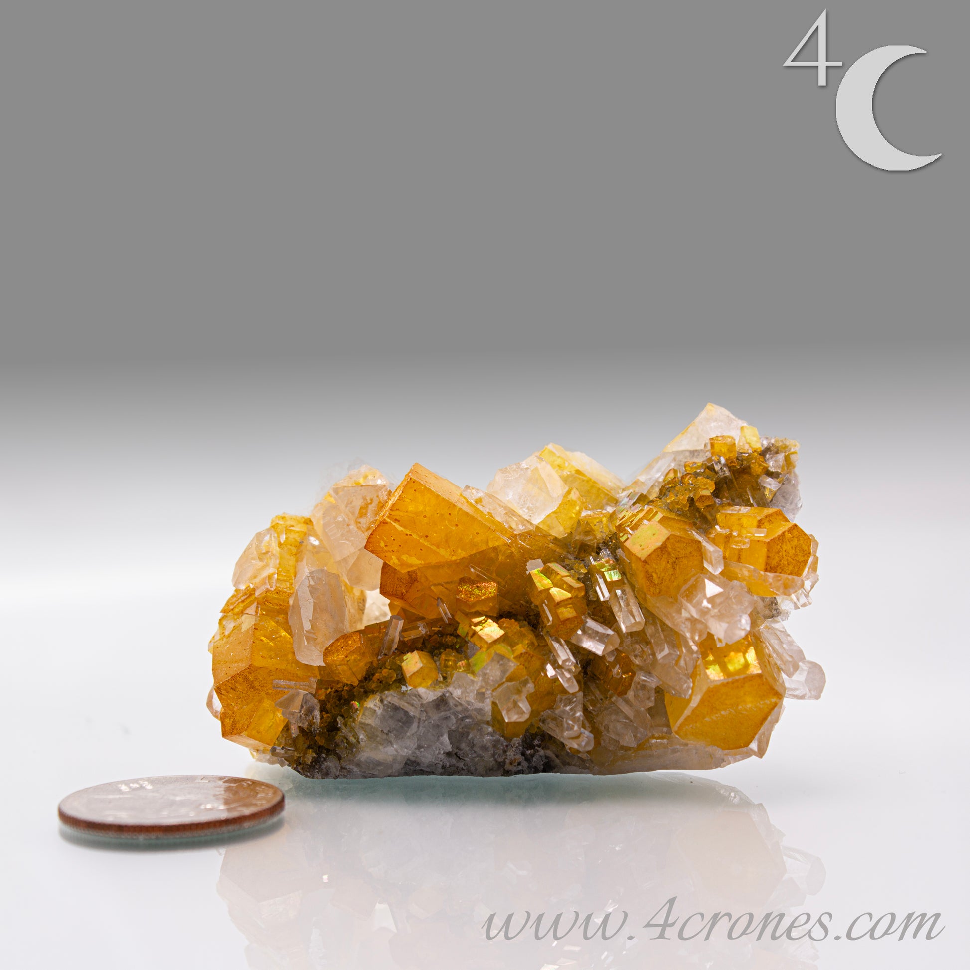 Iridescent Columnar Calcite is a striking variety of calcite distinguished by its naturally occurring columnar structure and shimmering, pearlescent sheen. This calcium carbonate mineral forms in elongated, parallel crystal columns, often displaying a soft, ethereal glow due to light interference within its layers. Its iridescence results from microscopic structural variations that reflect and refract light, producing subtle flashes of color that shift with movement.&nbsp;