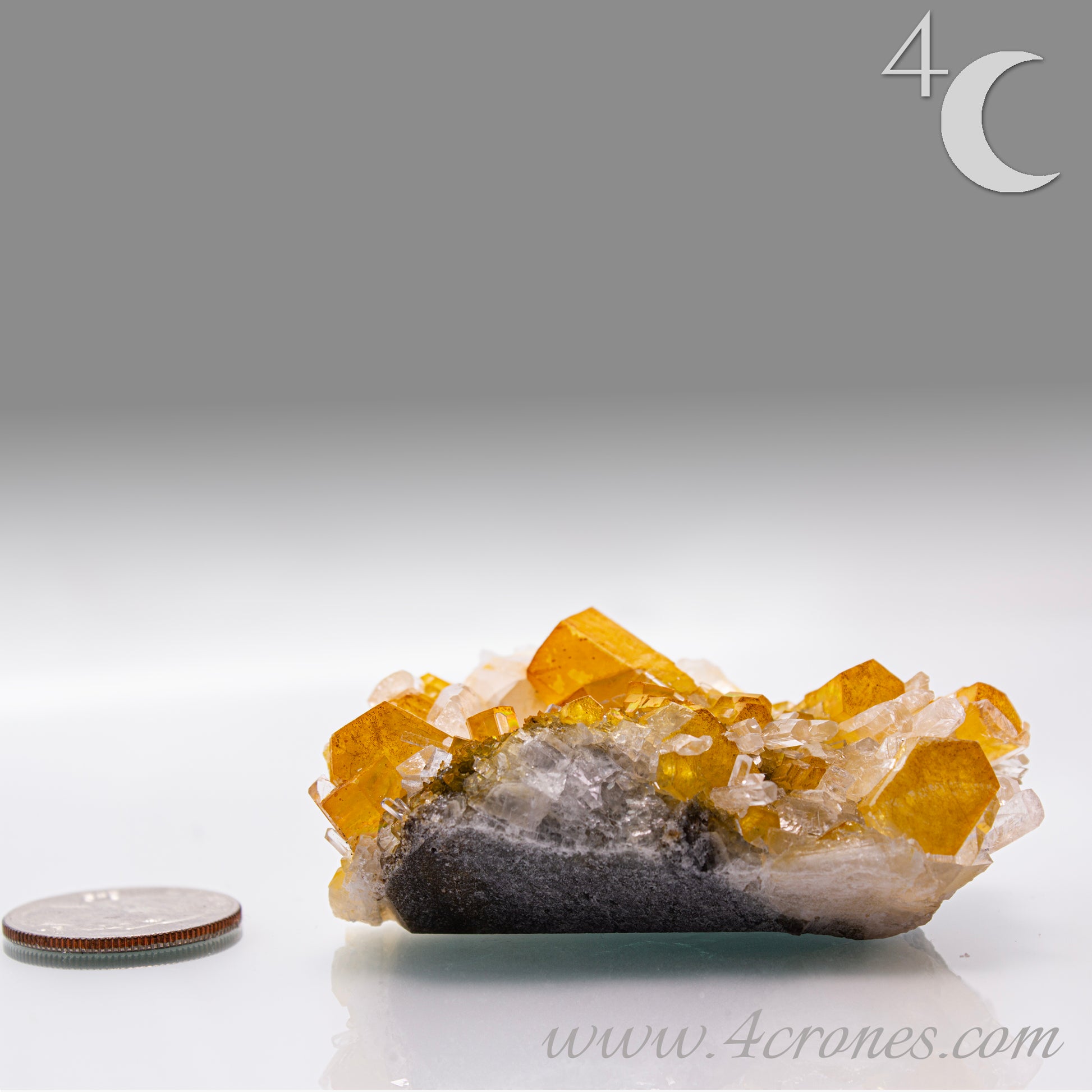 Iridescent Columnar Calcite is a striking variety of calcite distinguished by its naturally occurring columnar structure and shimmering, pearlescent sheen. This calcium carbonate mineral forms in elongated, parallel crystal columns, often displaying a soft, ethereal glow due to light interference within its layers. Its iridescence results from microscopic structural variations that reflect and refract light, producing subtle flashes of color that shift with movement.&nbsp;