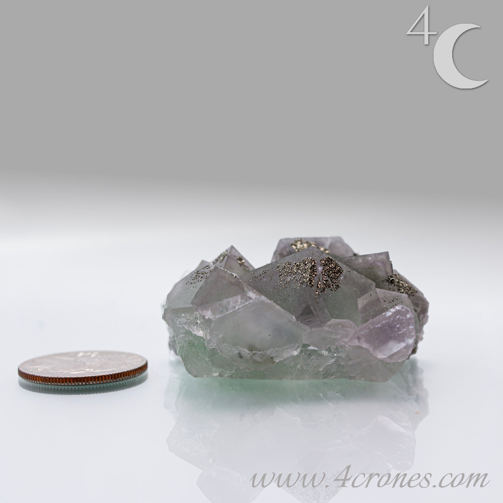 Fluorite & Pyrite beautiful lavender and soft green. This unique specimen of fluorite shimmers in soft bands of lavender and green, a natural harmony of color and energy. Composed of calcium fluoride, fluorite is valued for its cubic crystal formation and its ability to bring mental clarity and energetic alignment.