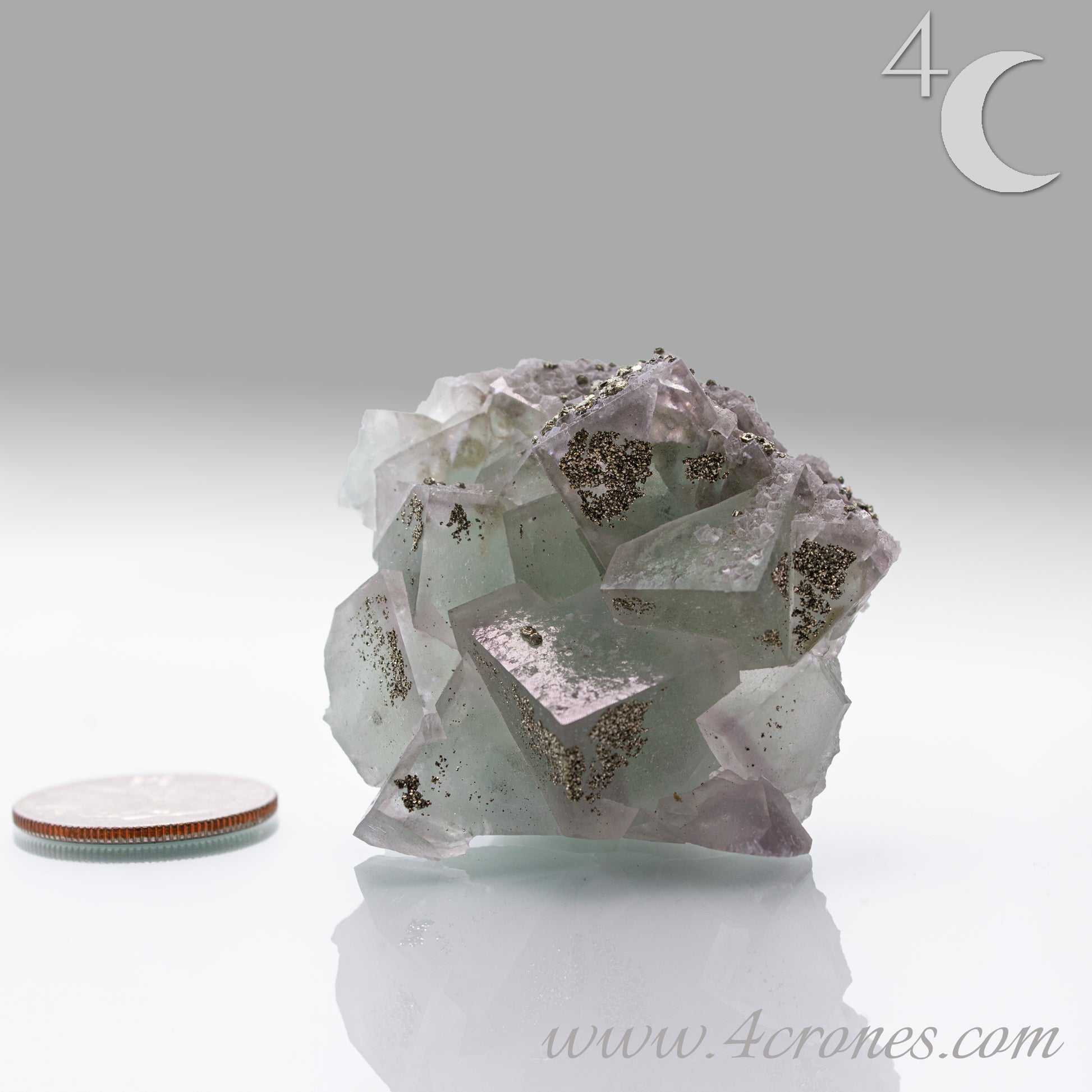 Fluorite & Pyrite beautiful lavender and soft green. This unique specimen of fluorite shimmers in soft bands of lavender and green, a natural harmony of color and energy. Composed of calcium fluoride, fluorite is valued for its cubic crystal formation and its ability to bring mental clarity and energetic alignment.