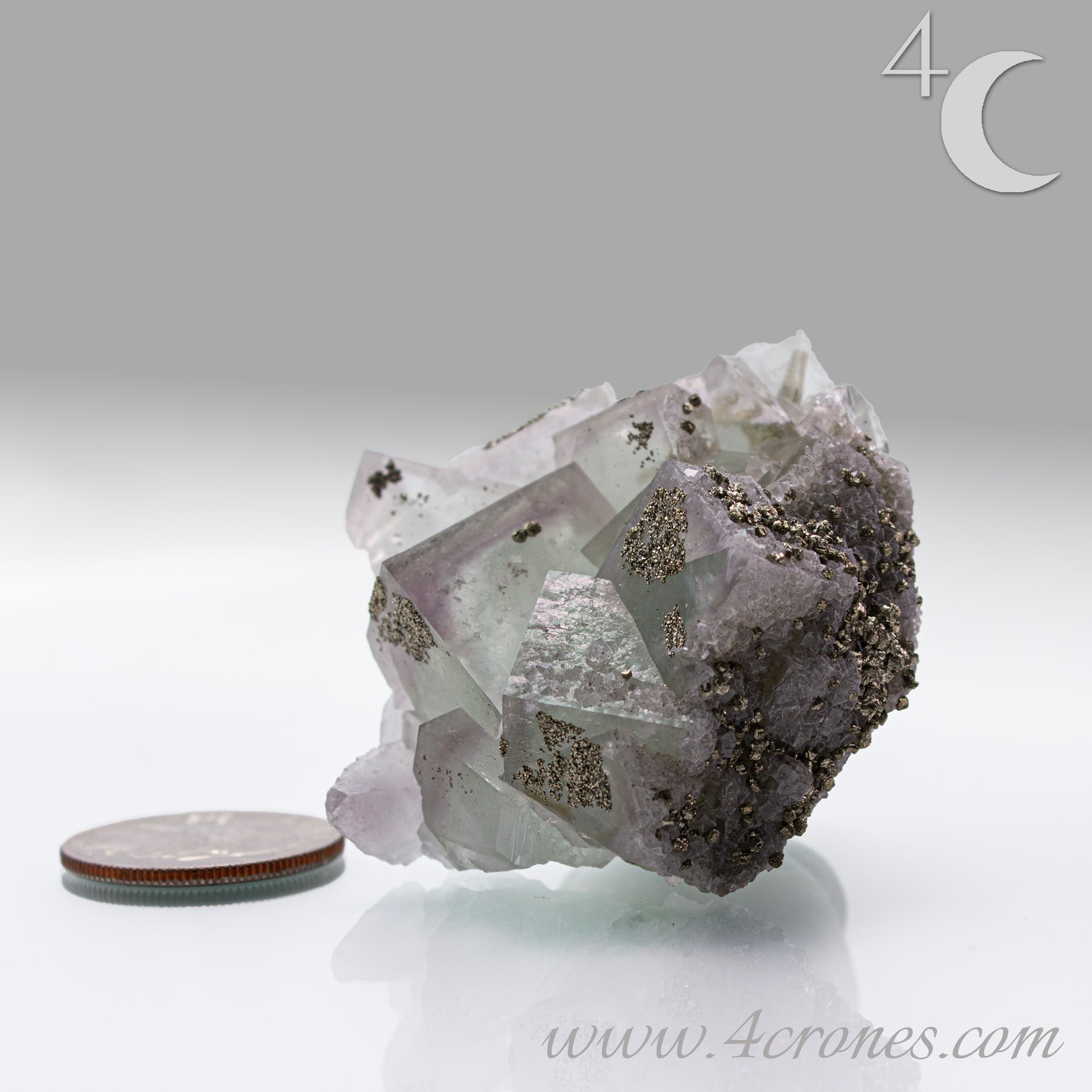 Fluorite & Pyrite beautiful lavender and soft green. This unique specimen of fluorite shimmers in soft bands of lavender and green, a natural harmony of color and energy. Composed of calcium fluoride, fluorite is valued for its cubic crystal formation and its ability to bring mental clarity and energetic alignment.