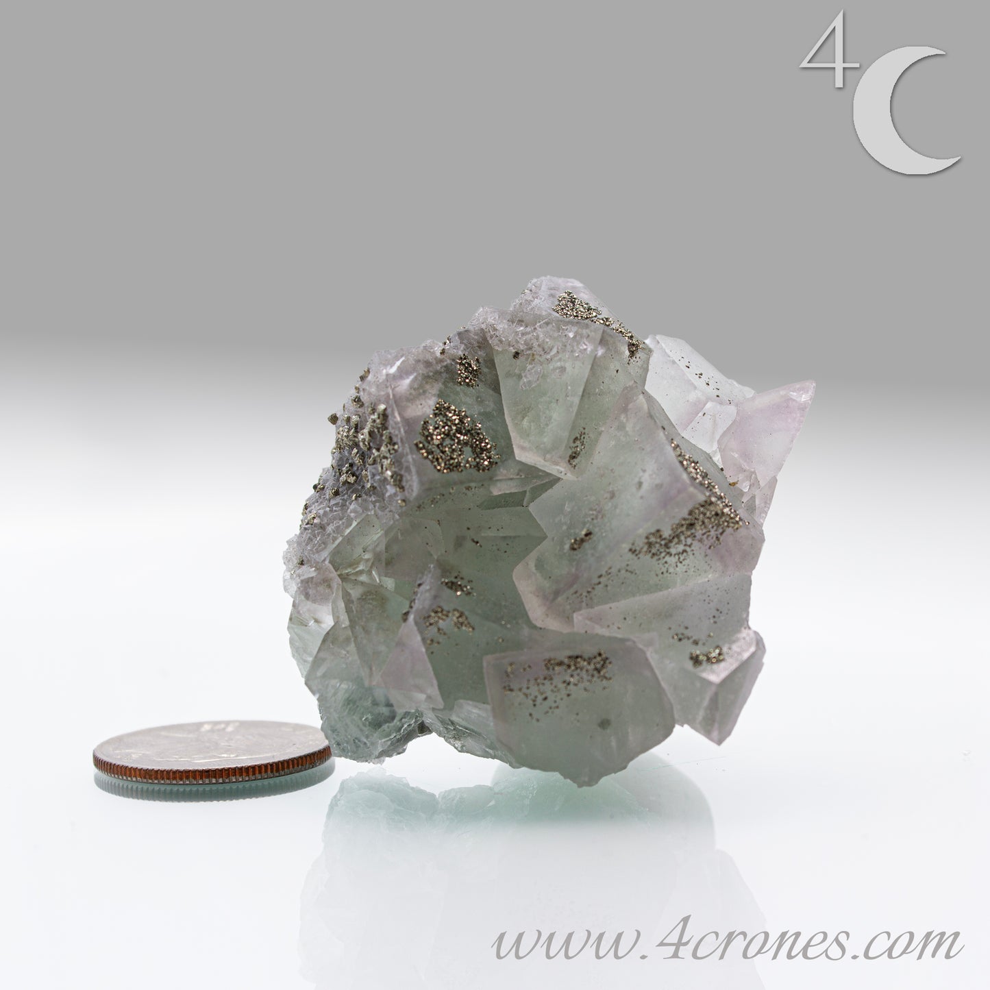 Fluorite & Pyrite beautiful lavender and soft green. This unique specimen of fluorite shimmers in soft bands of lavender and green, a natural harmony of color and energy. Composed of calcium fluoride, fluorite is valued for its cubic crystal formation and its ability to bring mental clarity and energetic alignment.