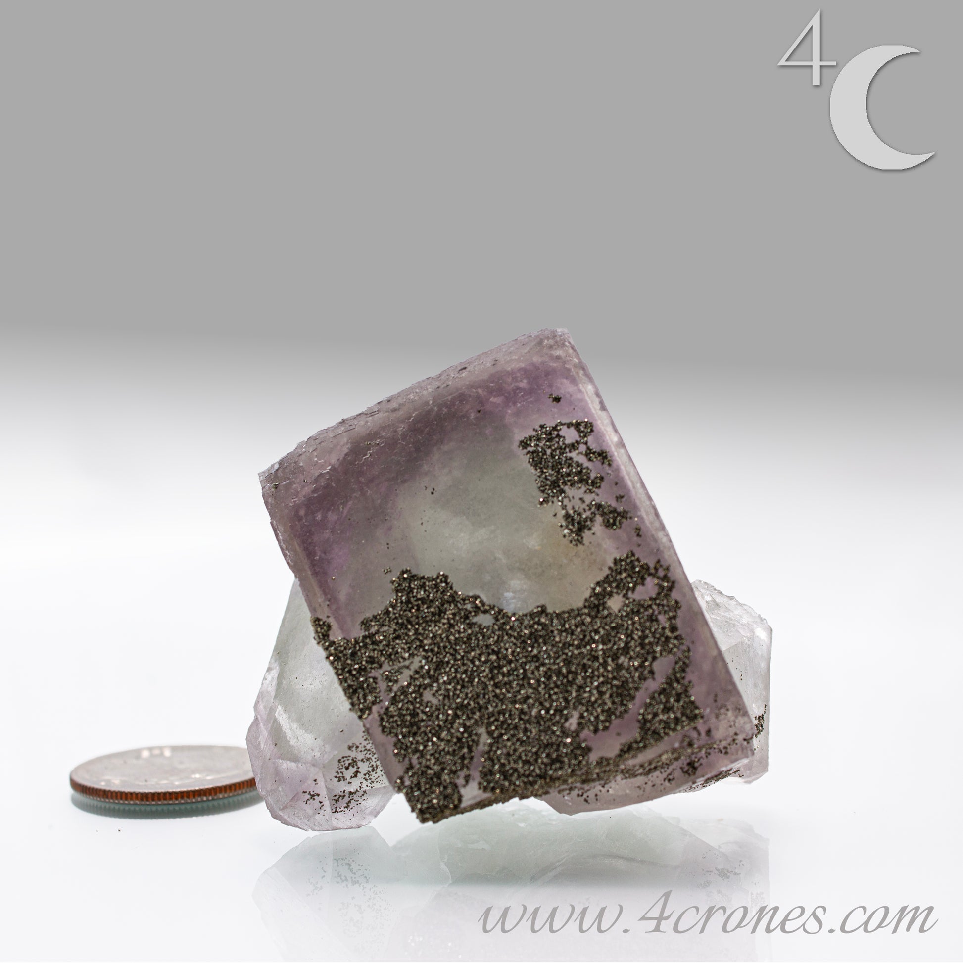Fluorite & Pyrite beautiful lavender and soft green. This unique specimen of fluorite shimmers in soft bands of lavender and green, a natural harmony of color and energy. Composed of calcium fluoride, fluorite is valued for its cubic crystal formation and its ability to bring mental clarity and energetic alignment.