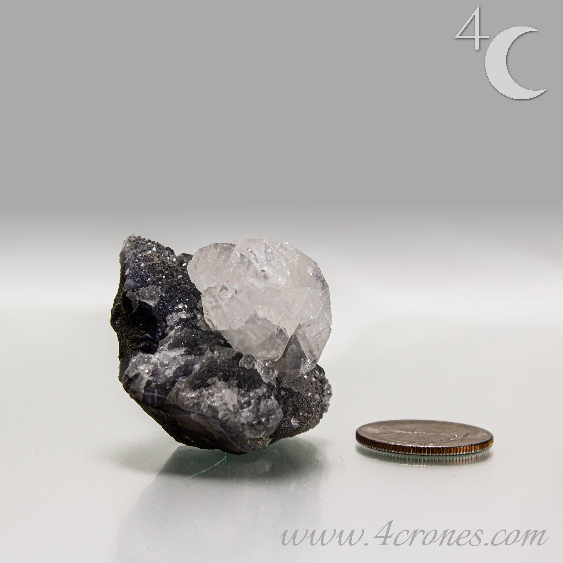 Apophyllite with chalcedony crystal cluster from India, clear apophyllite crystals on dark chalcedony matrix.