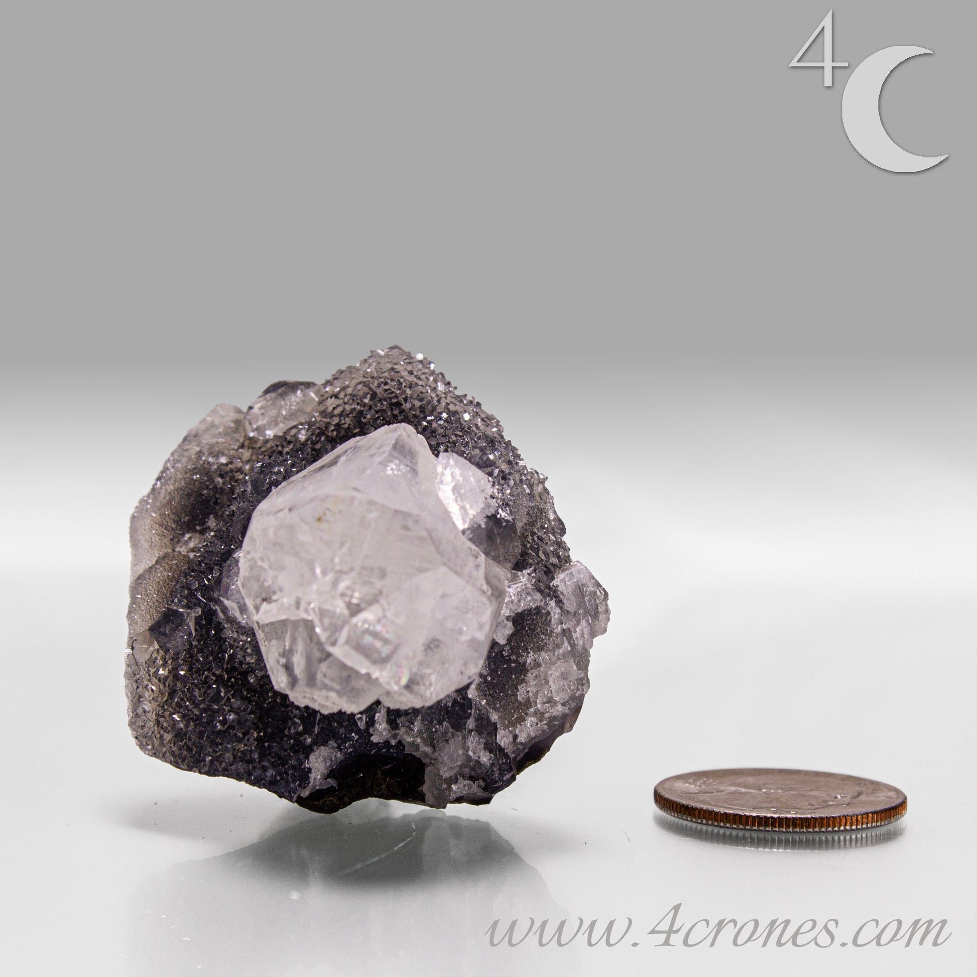 Apophyllite with chalcedony crystal cluster from India, clear apophyllite crystals on dark chalcedony matrix.