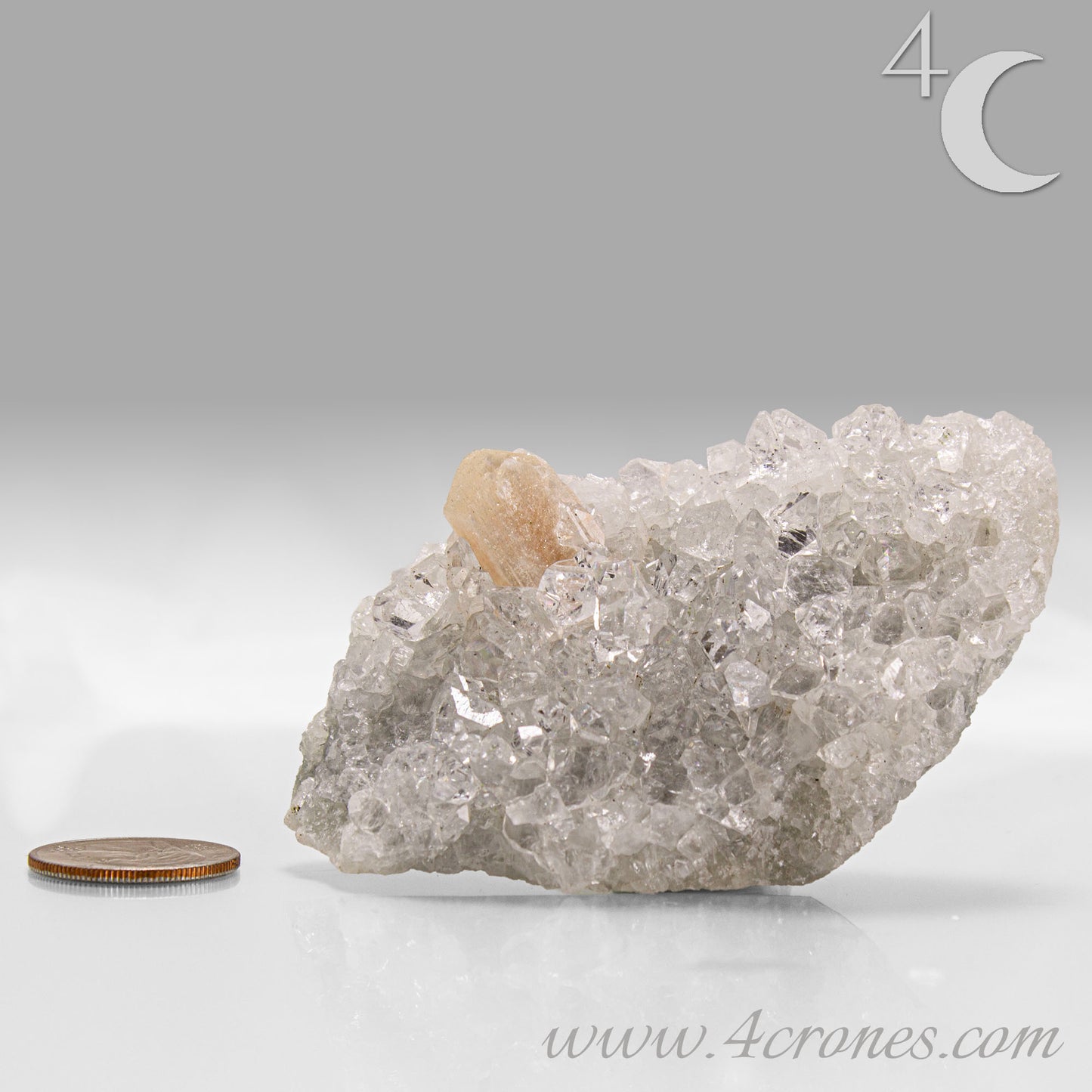 Clear apophyllite crystals intergrown with peach stilbite, natural zeolite mineral specimen from India.