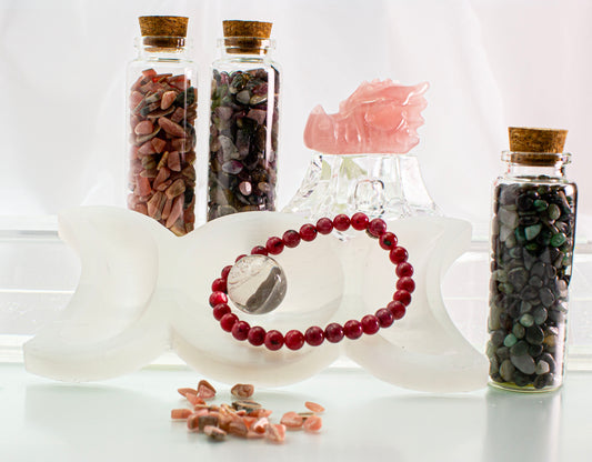 4 Crones Gift box Heart Fire, Rose Quartz Dragon head, Rhodonite bracelet, Rhodochrosite chips bottle, Emerald stone chips bottle, watermelon tourmaline chips, triple goddess selenite bowl, mini crystal quartz sphere.  