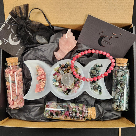 4 Crones Gift box Heart Fire, Rose Quartz Dragon head, Rhodonite bracelet, Rhodochrosite chips bottle, Emerald stone chips bottle, watermelon tourmaline chips, triple goddess selenite bowl, mini crystal quartz sphere. 