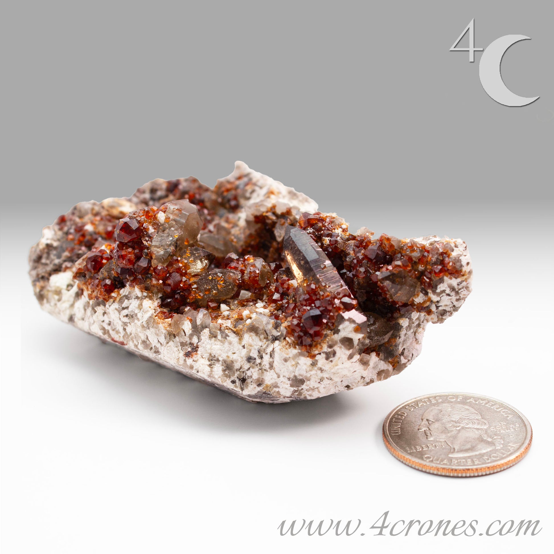 These gemmy Garnets are known as Spessartine Red Garnets, and they encrust and surround beautiful Smoky Quartz crystals on microcline feldspar matrices.  The mine these specimens come from is known for the beautiful blingy red- and orange-colored garnets that they yield. www.4crones.com