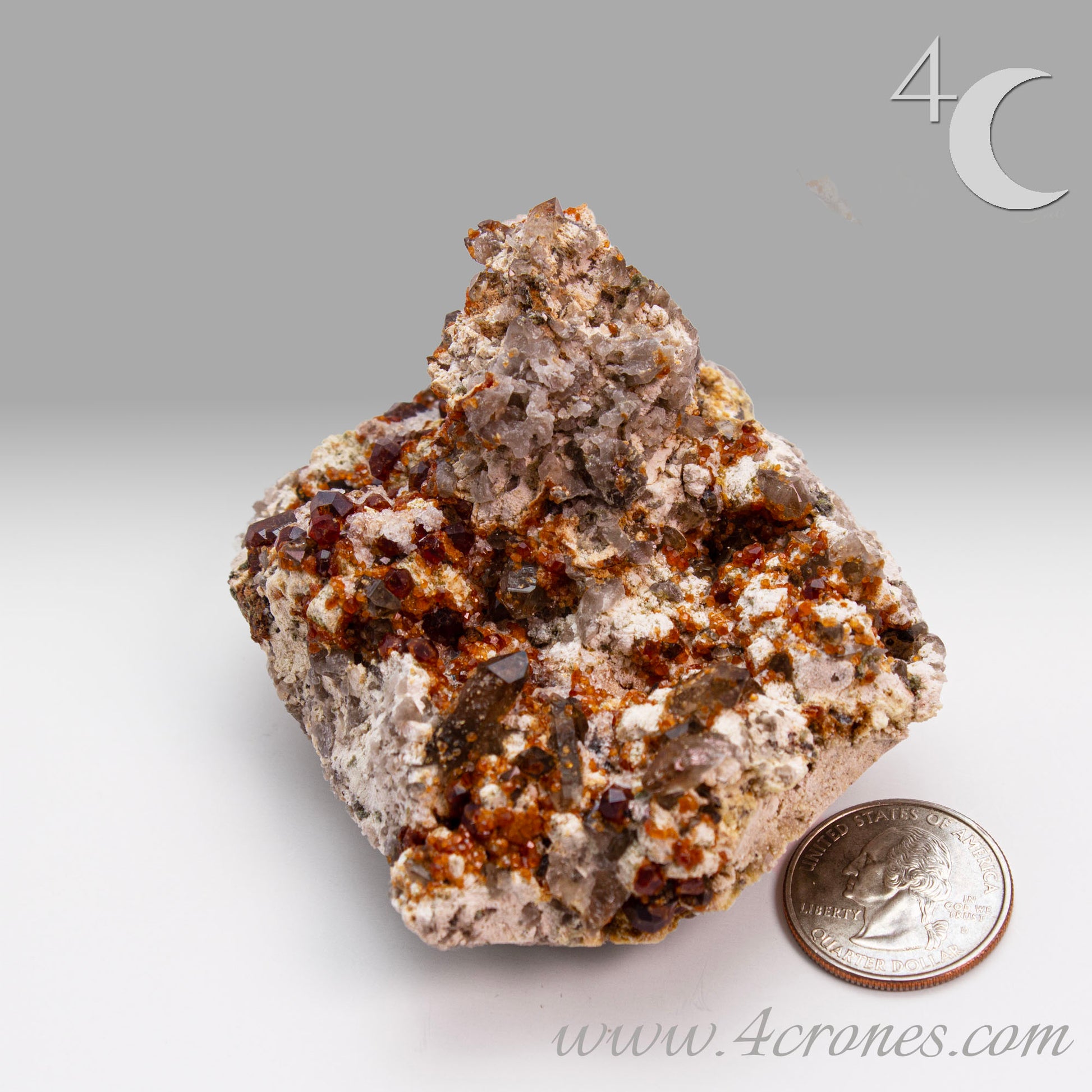 These gemmy Garnets are known as Spessartine Red Garnets, and they encrust and surround beautiful Smoky Quartz crystals on microcline feldspar matrices.  The mine these specimens come from is known for the beautiful blingy red- and orange-colored garnets that they yield. www.4crones.com