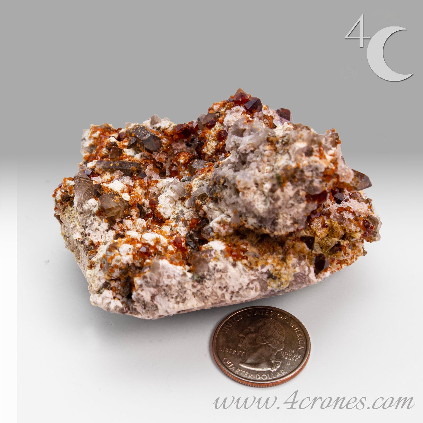 These gemmy Garnets are known as Spessartine Red Garnets, and they encrust and surround beautiful Smoky Quartz crystals on microcline feldspar matrices.  The mine these specimens come from is known for the beautiful blingy red- and orange-colored garnets that they yield. www.4crones.com
