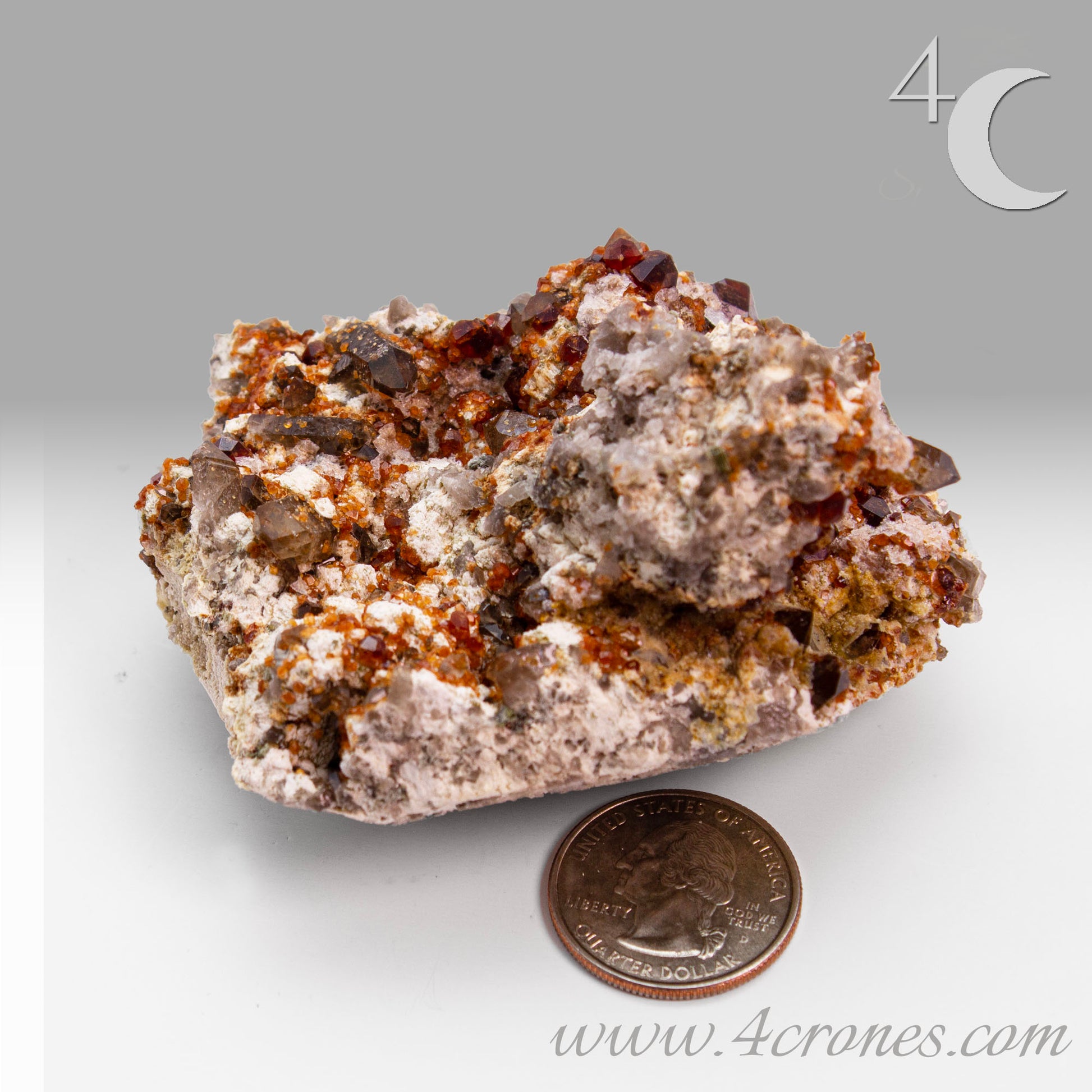 These gemmy Garnets are known as Spessartine Red Garnets, and they encrust and surround beautiful Smoky Quartz crystals on microcline feldspar matrices.  The mine these specimens come from is known for the beautiful blingy red- and orange-colored garnets that they yield. www.4crones.com