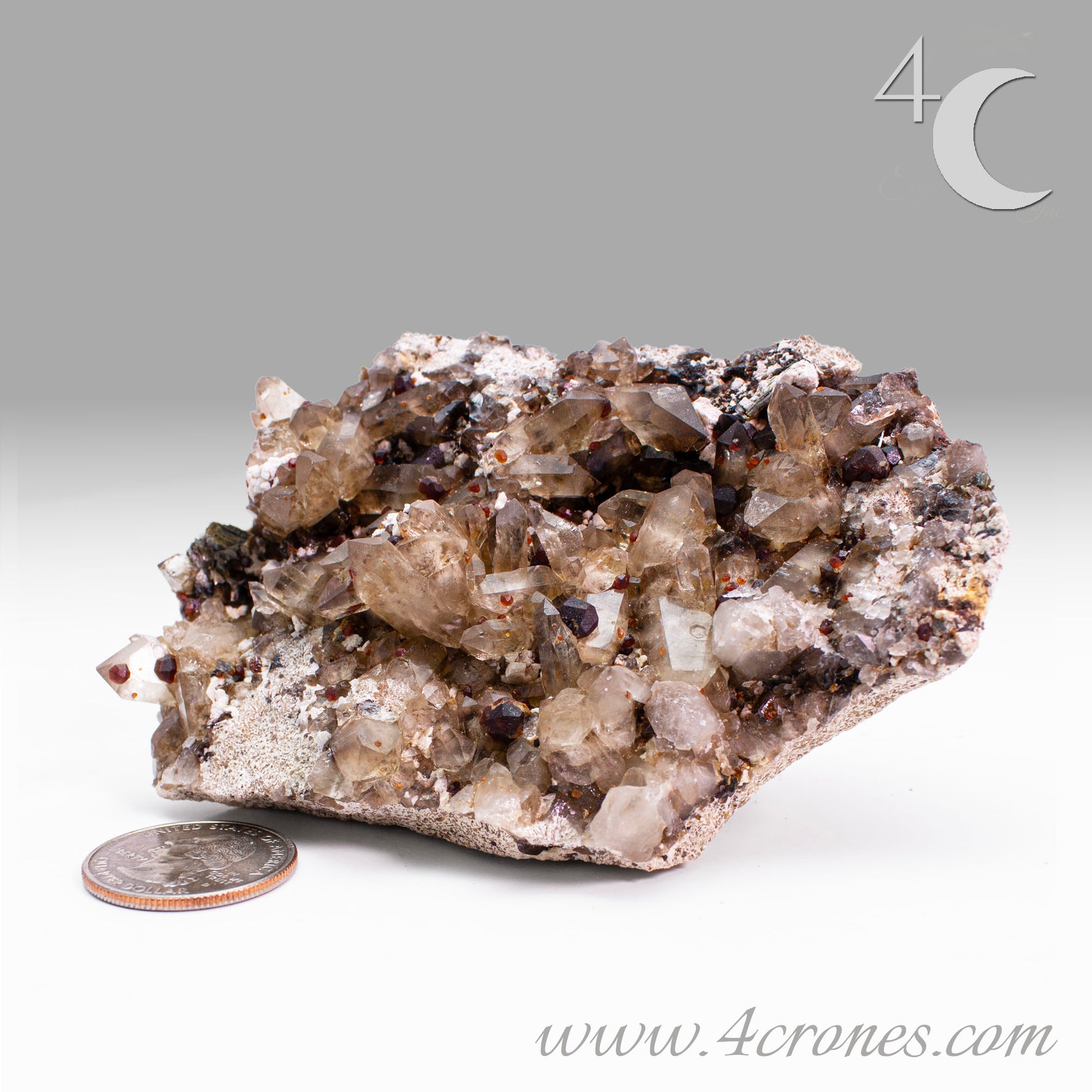 These gemmy Garnets are known as Spessartine Red Garnets, and they encrust and surround beautiful Smoky Quartz crystals on microcline feldspar matrices.  The mine these specimens come from is known for the beautiful blingy red- and orange-colored garnets that they yield. www.4crones.com