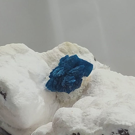 Cavansite is a rare calcium vanadium silicate mineral prized for its vivid blue color and rosette-like crystal formations