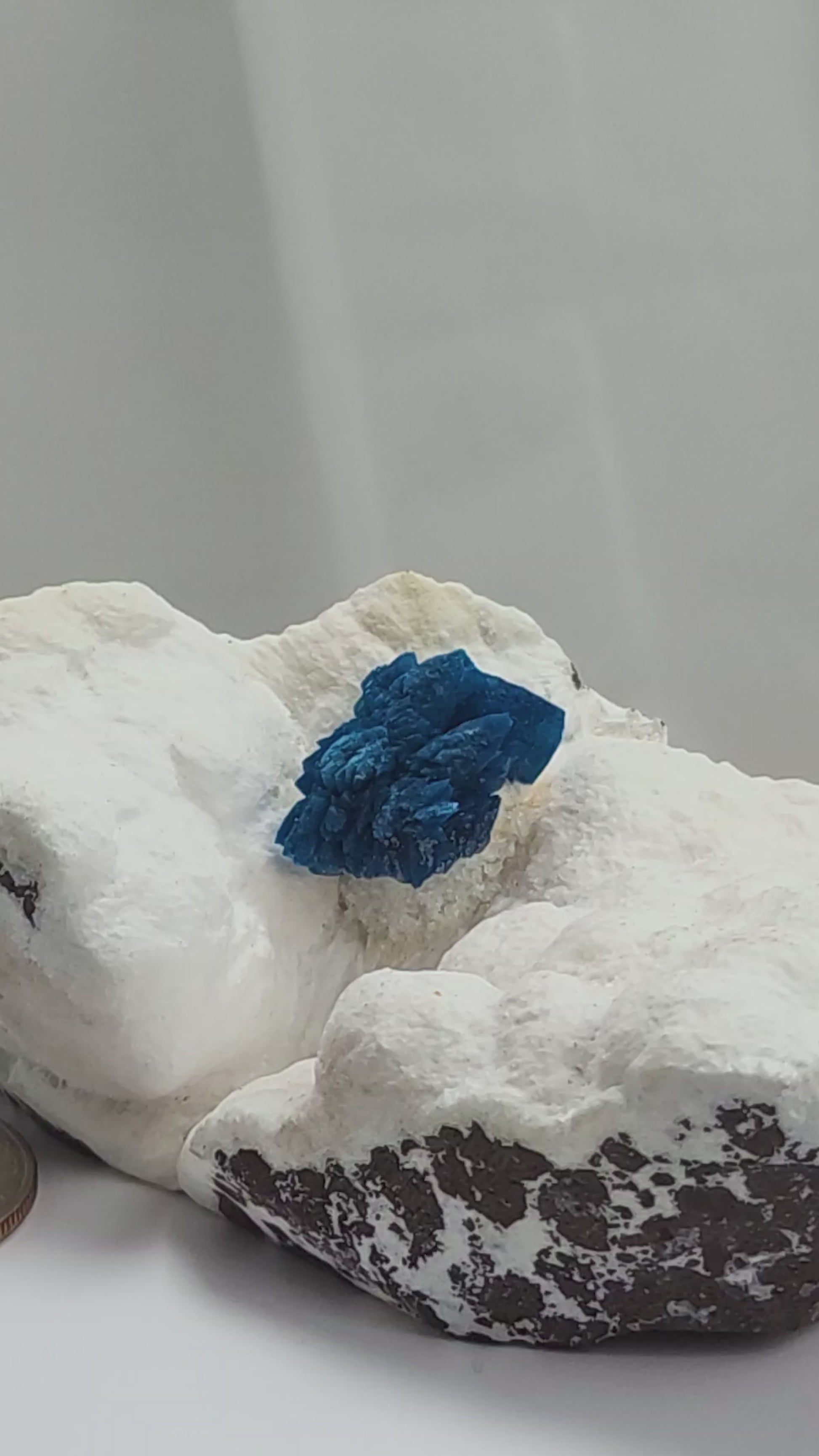 Cavansite is a rare calcium vanadium silicate mineral prized for its vivid blue color and rosette-like crystal formations