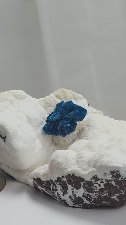 Cavansite is a rare calcium vanadium silicate mineral prized for its vivid blue color and rosette-like crystal formations