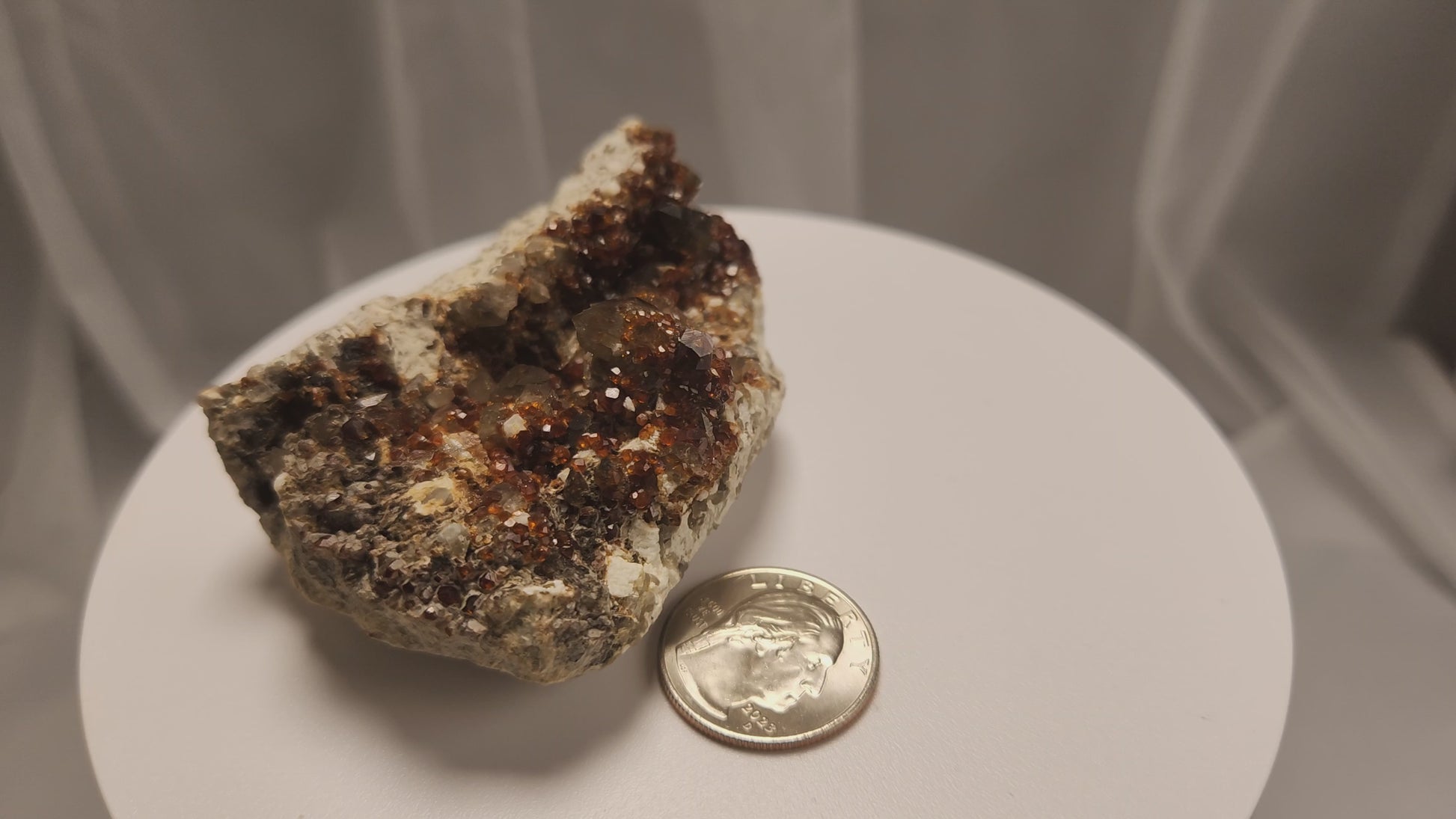 These gemmy Garnets are known as Spessartine Red Garnets, and they encrust and surround beautiful Smoky Quartz crystals on microcline feldspar matrices.  The mine these specimens come from is known for the beautiful blingy red- and orange-colored garnets that they yield.