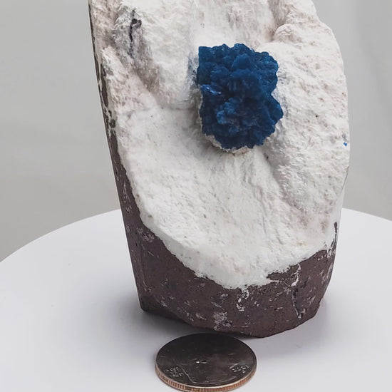Cavansite is a rare calcium vanadium silicate mineral prized for its vivid blue color and rosette-like crystal formations