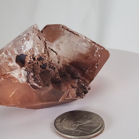 Red Diamond Calcite, glassy, gemmy diamond shaped geometries otherwise known as rhombohedrons and or scalenohedrons are combined with iron oxide hematoid inclusions. www.4crones.com