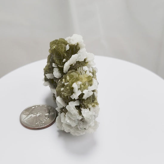 This unique pairing of Siderite, an iron carbonate mineral, and Dolomite, a calcium magnesium carbonate, forms in earthy clusters and blocky crystals that range from honeyed brown to soft cream.