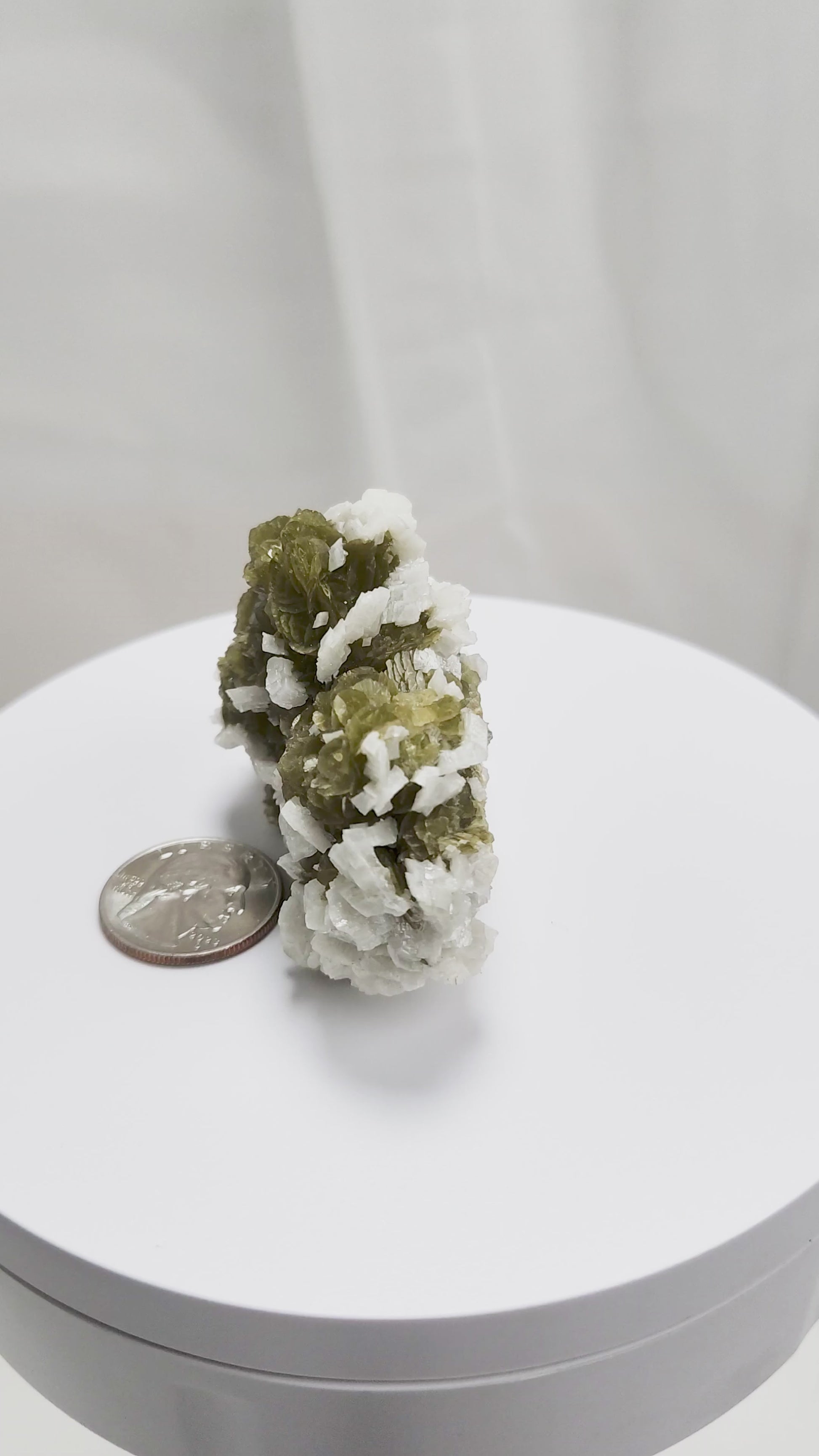 This unique pairing of Siderite, an iron carbonate mineral, and Dolomite, a calcium magnesium carbonate, forms in earthy clusters and blocky crystals that range from honeyed brown to soft cream.