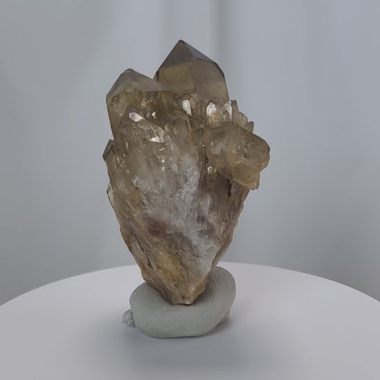 Kundalini Citrine Quartz is a stunning and rare variety of Citrine found exclusively in the Democratic Republic of Congo. This Natural Citrine is also characterized by a distinct formation of multiple terminated smaller Kundalini Quartz crystals.