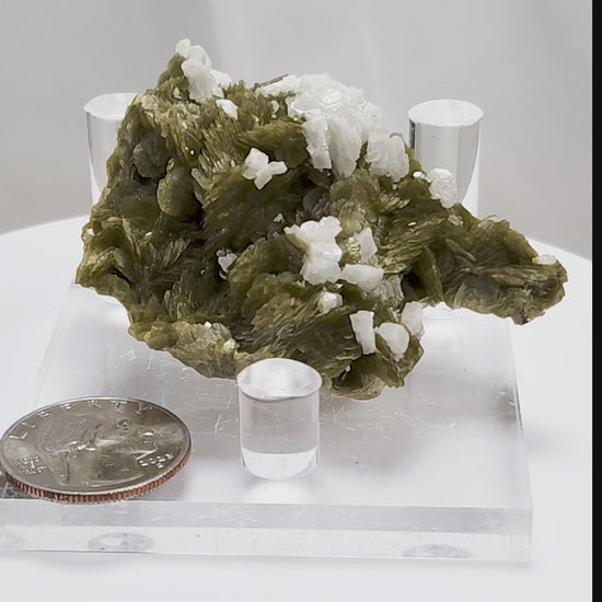 This unique pairing of Siderite, an iron carbonate mineral, and Dolomite, a calcium magnesium carbonate, forms in earthy clusters and blocky crystals that range from honeyed brown to soft cream.