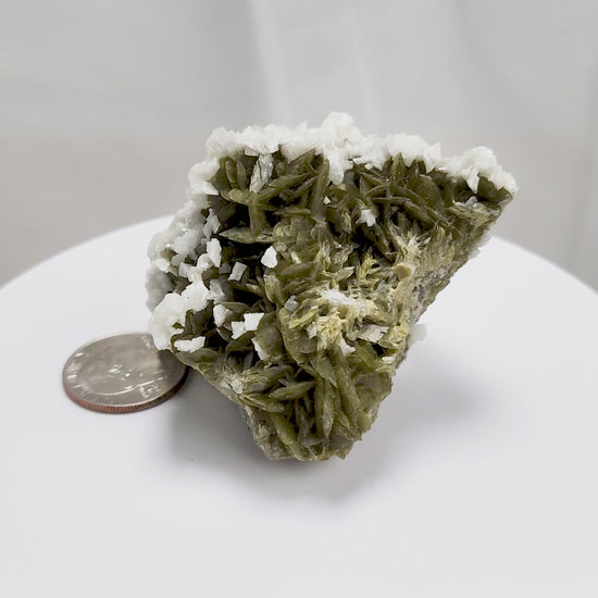 This unique pairing of Siderite, an iron carbonate mineral, and Dolomite, a calcium magnesium carbonate, forms in earthy clusters and blocky crystals that range from honeyed brown to soft cream.
